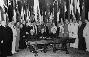 Allied nations’ representatives gather around U.S. President Franklin Roosevelt, second from left at table, to sign the United Nations Declaration in January 1942.